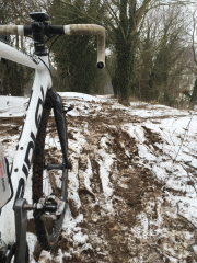 Cycling in dirty snowdrifts on Weavers Way