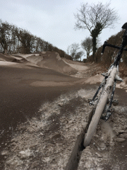 Cycling in brown snow -  Felmingham