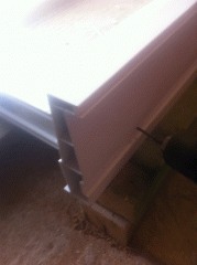 Fixing the bottom sill on a uPVC door